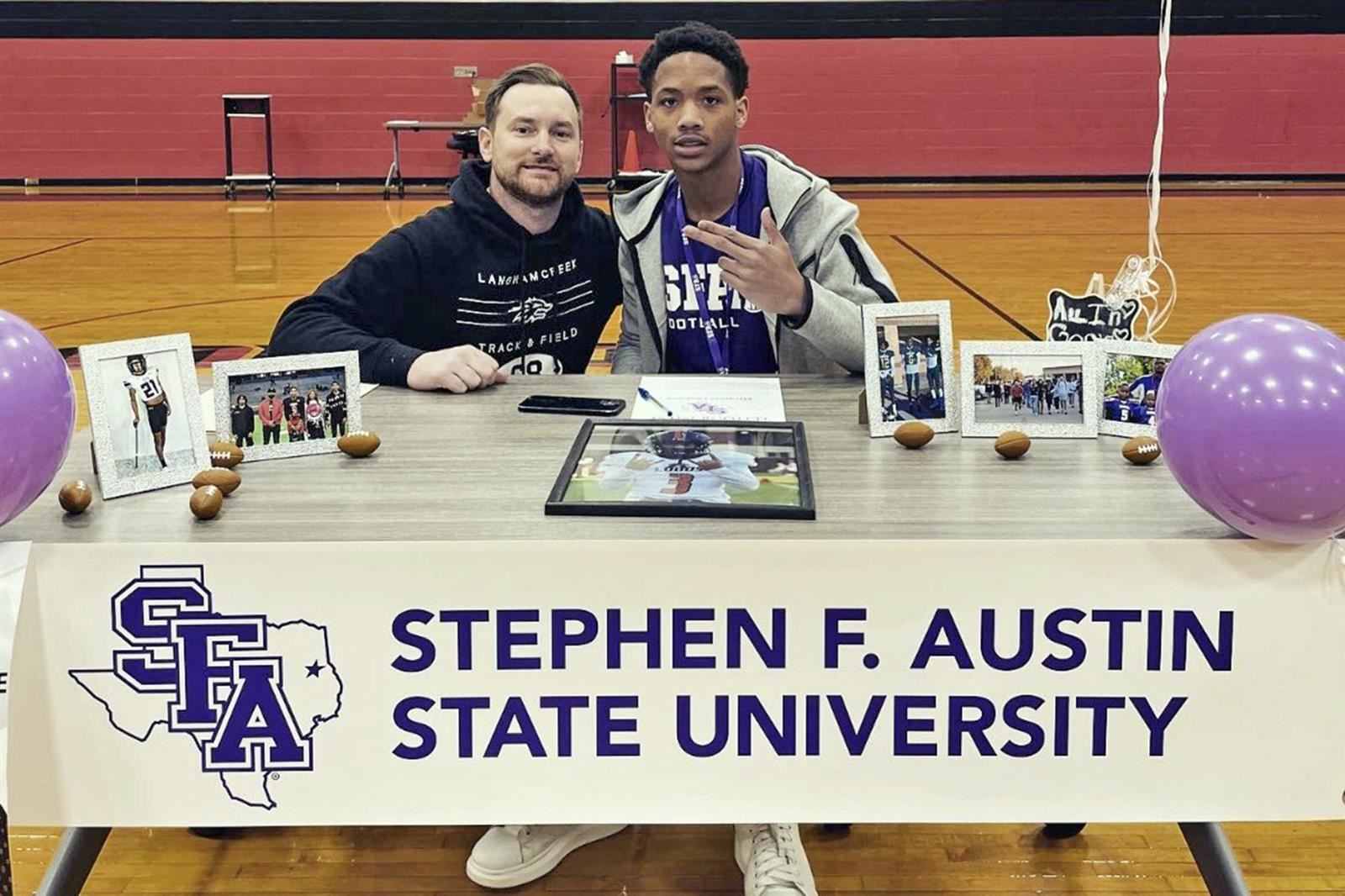 Langham Creek senior Marquese Chapman, right, signed his letter of intent to Stephen F. Austin State University.